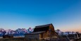 First light hitting the Grand Tetons behind Mormon Row Barn (click the image to purchase a print!)
