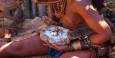Traditional Himba applying her 